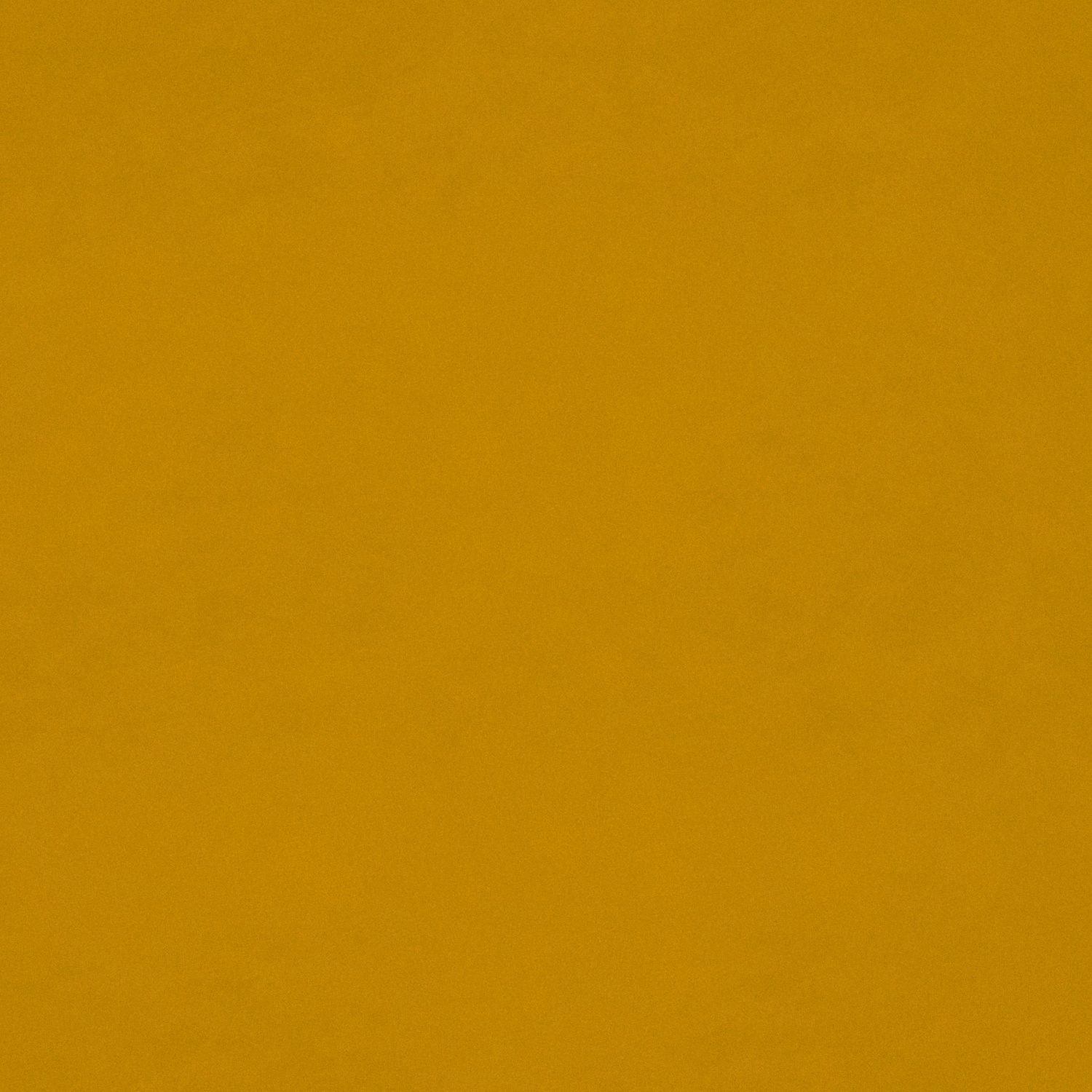 Close-up of plain ochre-gold velvet showing a soft, subtly shaded pile