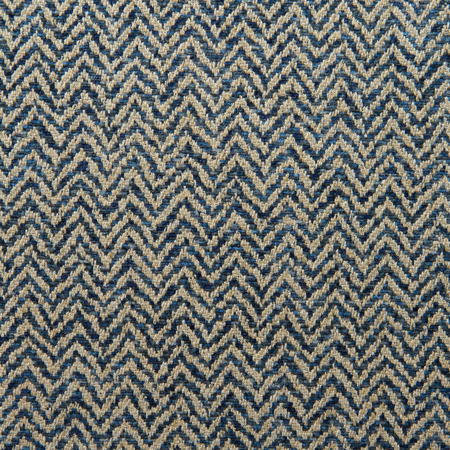 Navy and oatmeal herringbone zigzags in a dense, textured woven close-up