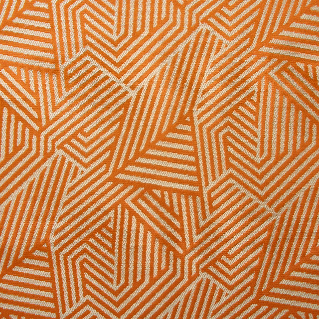 Tangerine and ivory woven fabric with interlocking angular chevrons and ribbed lines