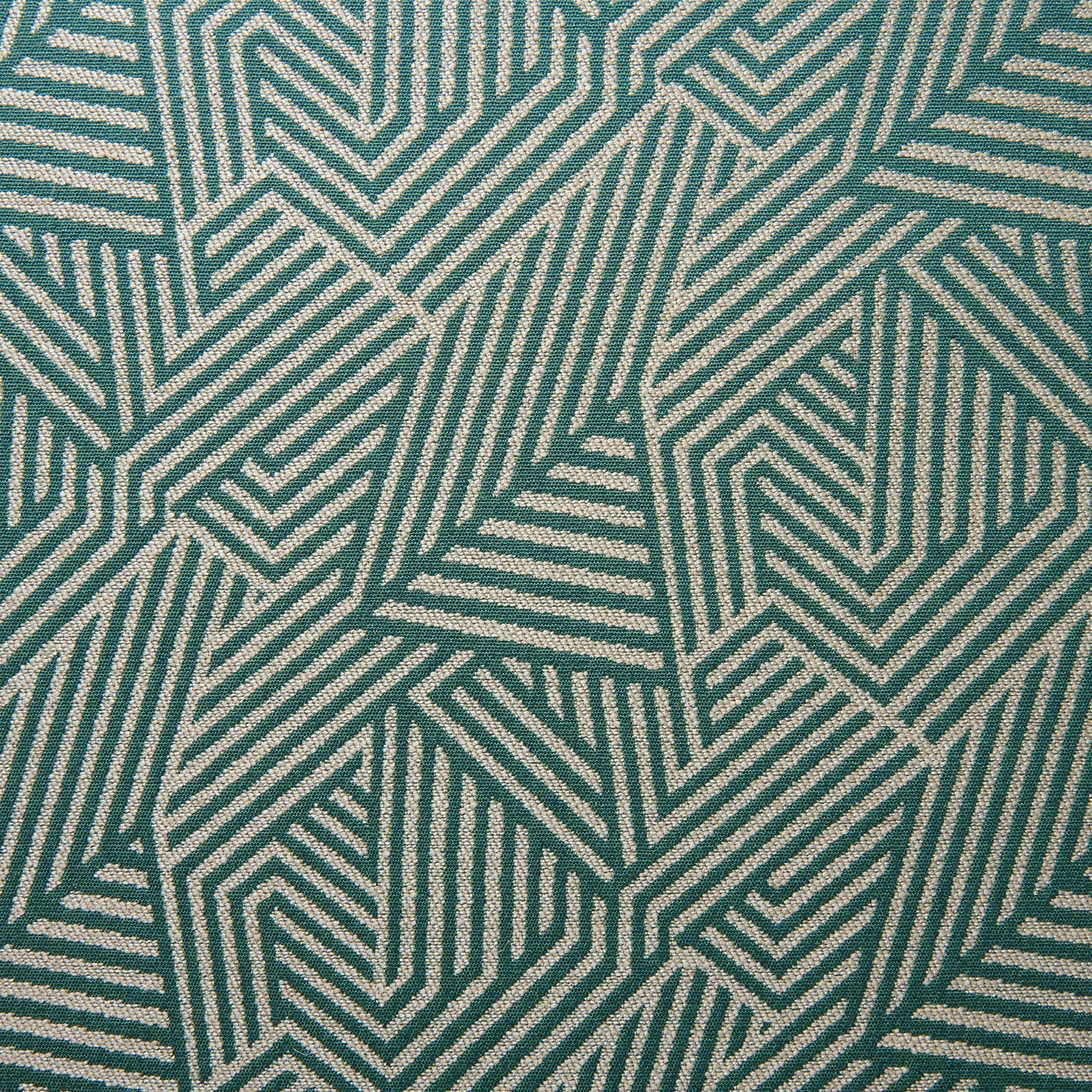 Close-up of muted teal woven fabric with pale interlocking geometric chevrons