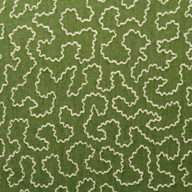 Muted avocado-green woven fabric with cream irregular squiggle outlines