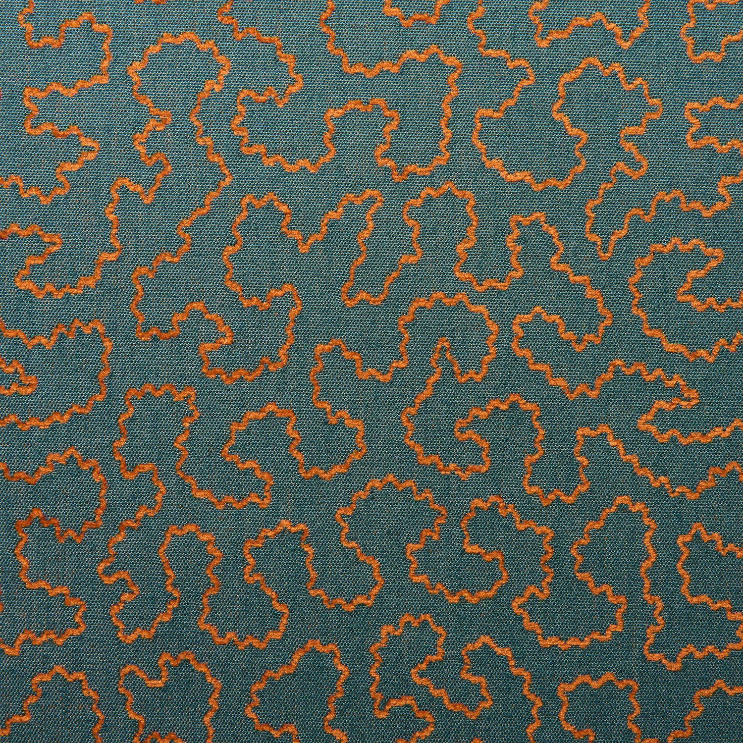 Teal woven fabric with small irregular terracotta-orange outlined motifs