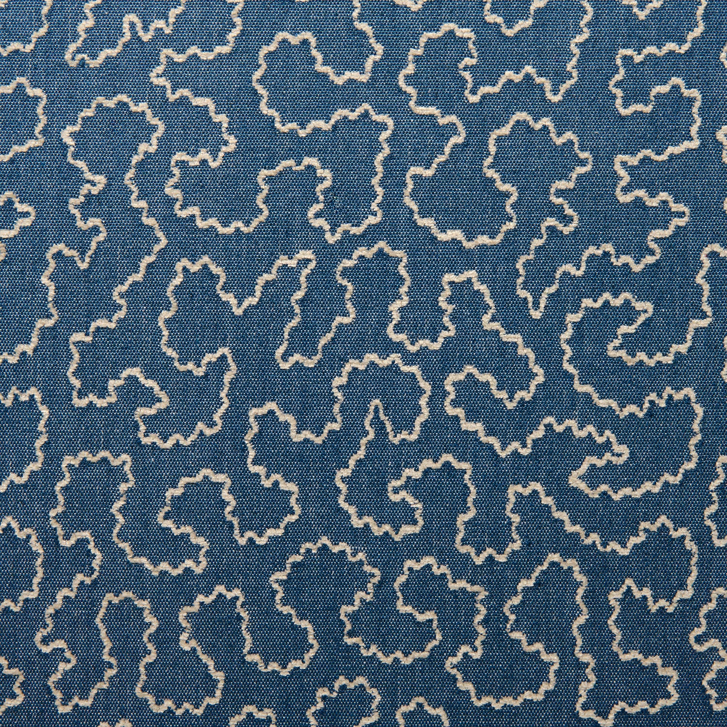 Cornflower-blue woven fabric with cream irregular outlined motifs and fine textured ground