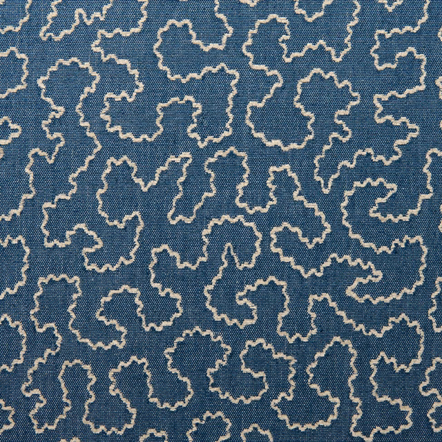 Cornflower-blue woven fabric with cream irregular outlined motifs and fine textured ground
