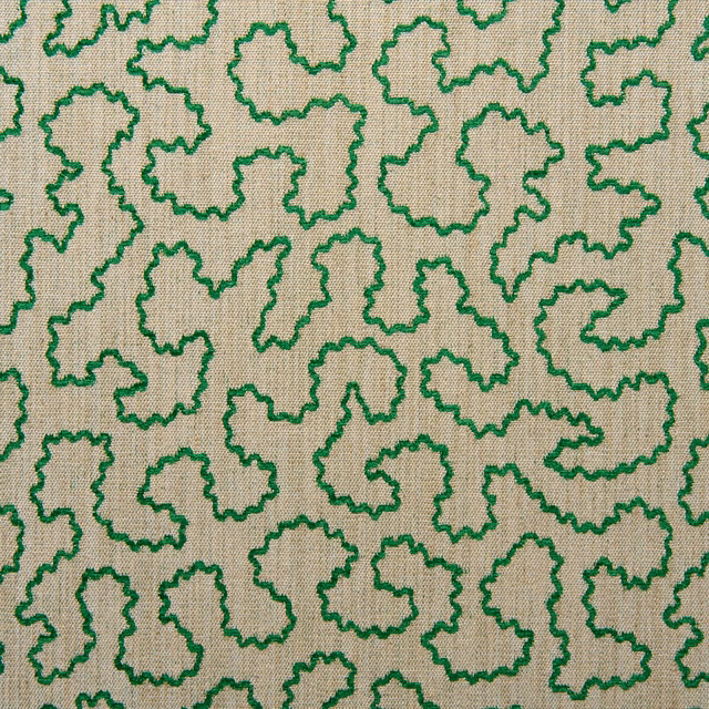 Emerald green squiggle outlines across a finely woven beige fabric