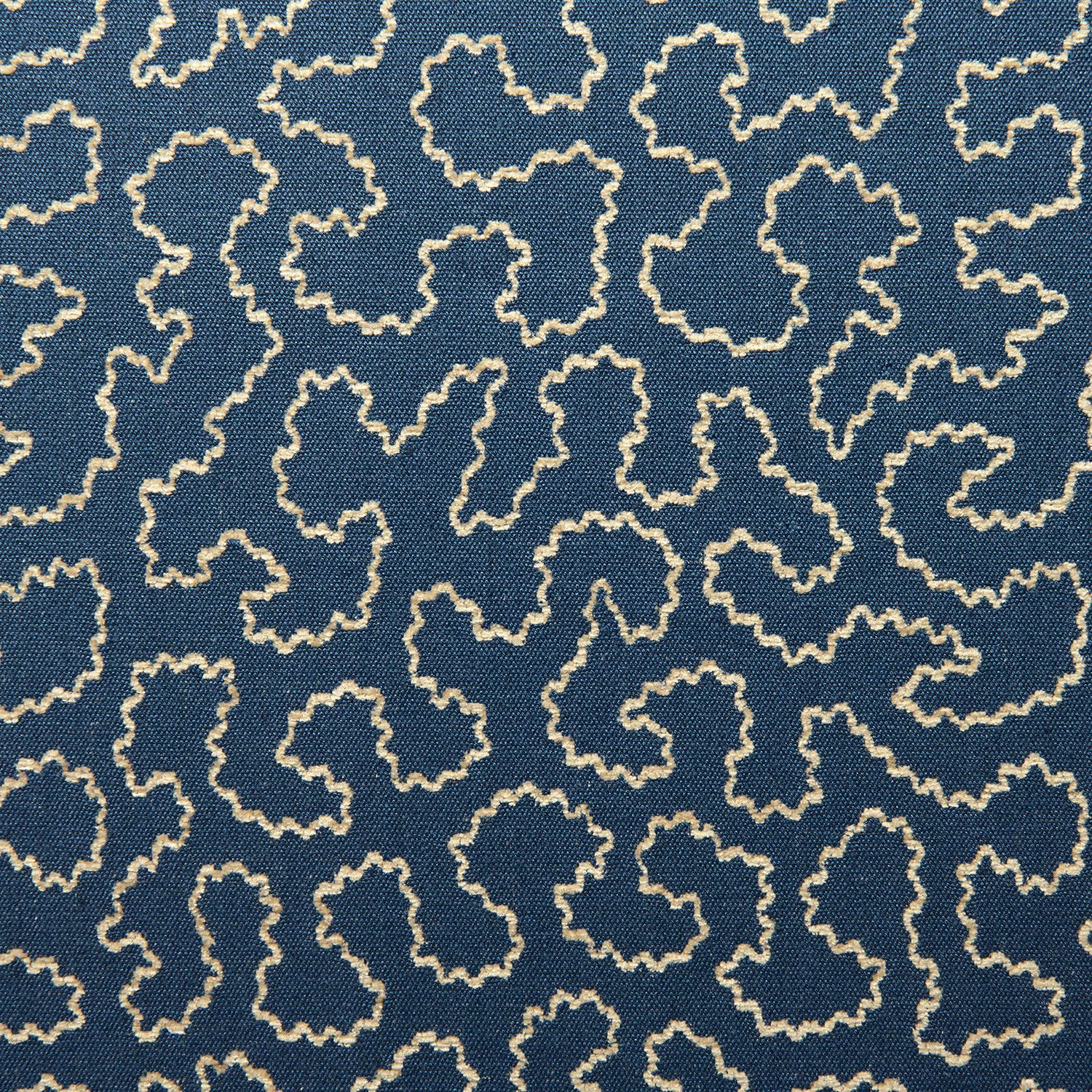 Regal blue woven fabric with irregular ivory looping outlines and tactile texture
