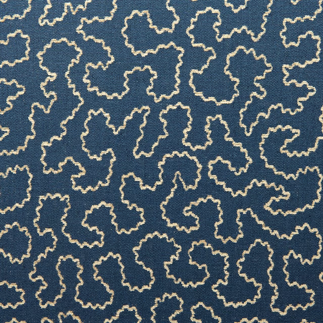 Regal blue woven fabric with irregular ivory looping outlines and tactile texture