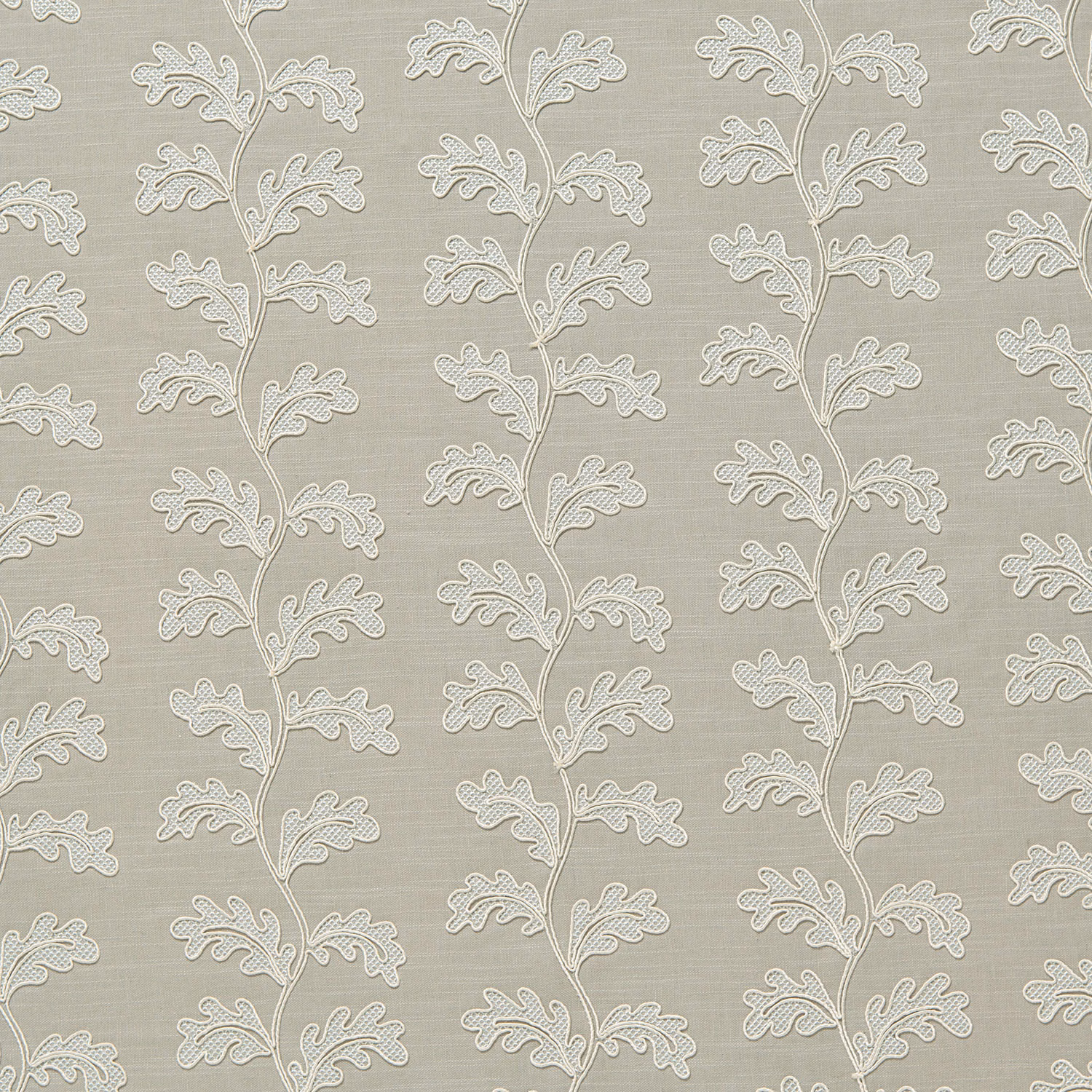 Pale dove grey woven fabric with raised trailing leaf motif