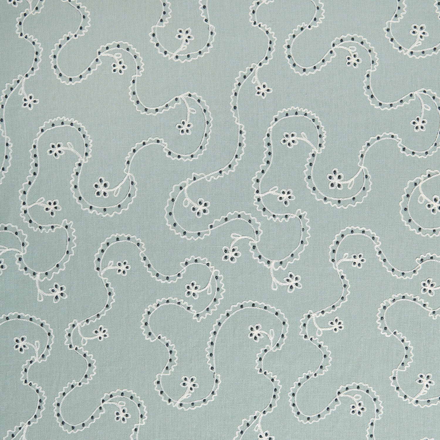 Pale mint green fabric with white scrolling embroidery-style pattern and dark dotted accents