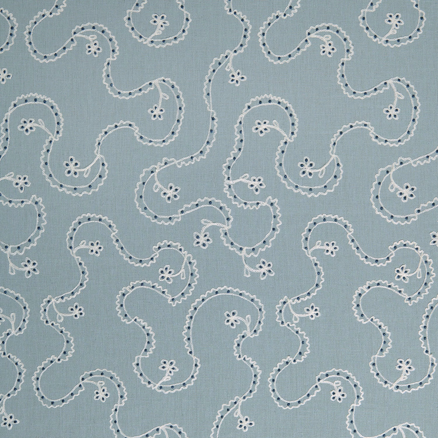 Powder-blue embroidered cushion fabric with scrolling vine motif and small floral details