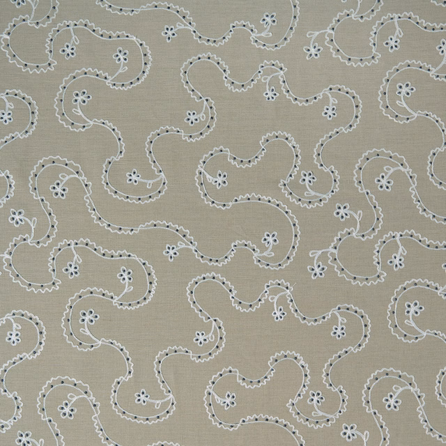 Taupe beige patterned cushion fabric with white trailing floral scrolls