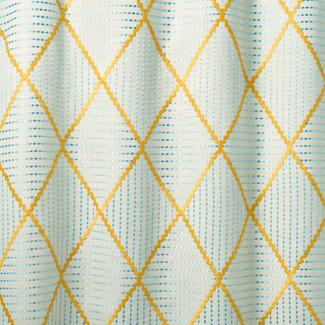 Cream fabric with gold diamond lattice and turquoise dash detailing