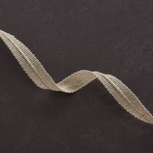 Charcoal fabric with a raised natural-beige wavy woven line across its surface