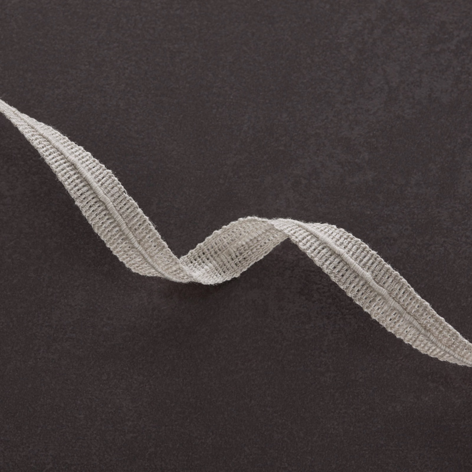 Charcoal fabric with a raised silver-grey winding branch-like motif