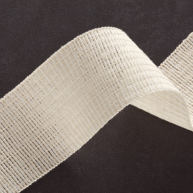 Warm ivory open-weave textile folded into a softly ridged, dimensional swatch