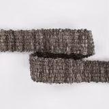 Two folded strips show Bordure Chestnut’s mottled chestnut-brown looped texture