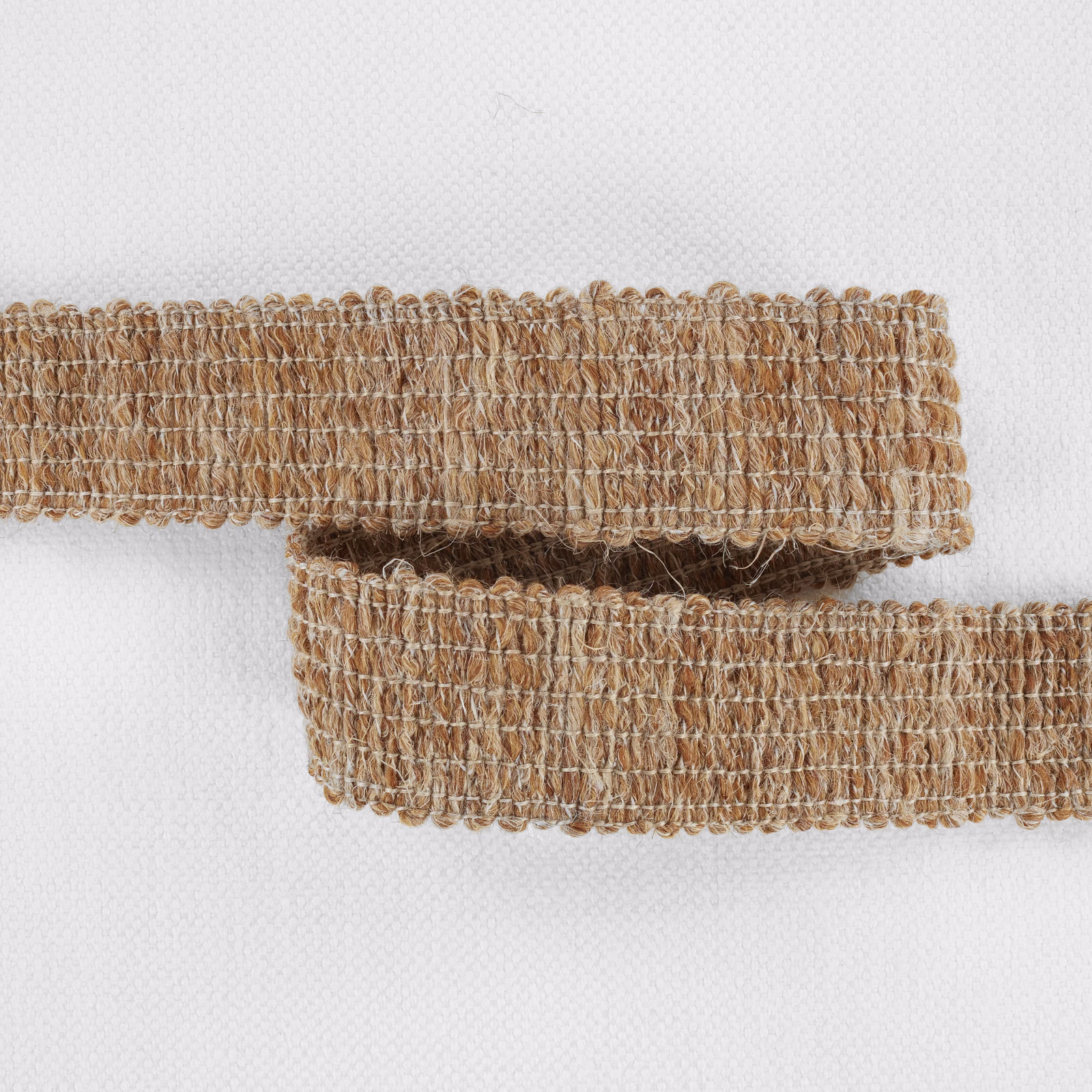 Warm moccasin tan woven swatch with raised loops and dense horizontal texture