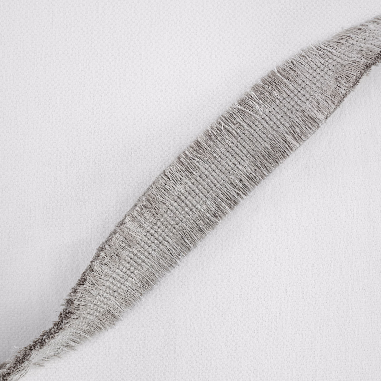 Cement-grey woven fabric with a raised feather-like diagonal motif