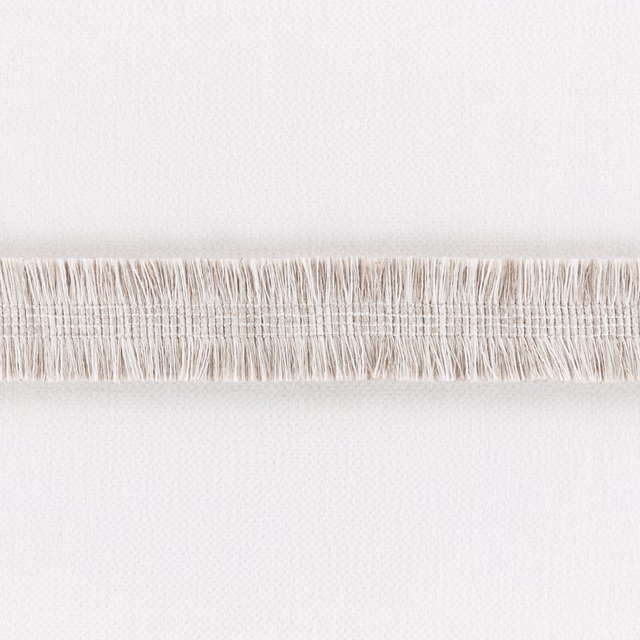 Pale ecru woven fabric with a horizontal band of fine loose fringe