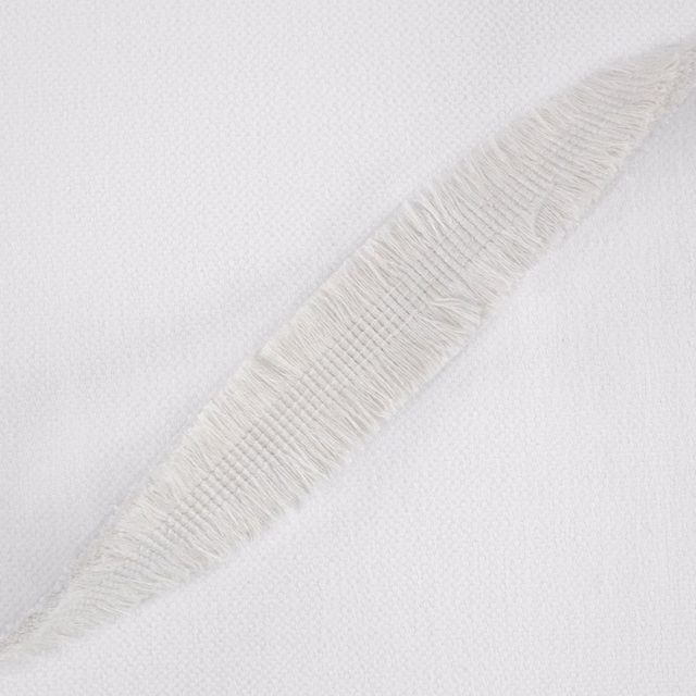 Ivory-white woven fabric with a raised diagonal feather-like motif and fine texture