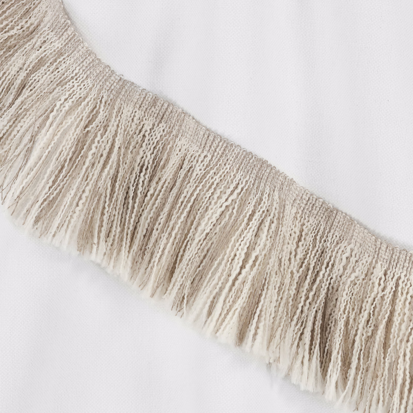 Warm beige woven fringe with long irregular tassels and open textured band