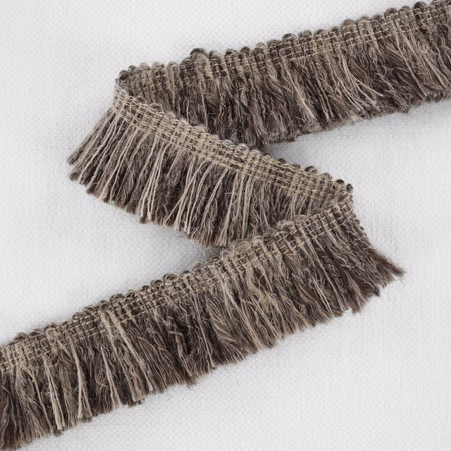 Chestnut, taupe and charcoal fringe with a loose, richly textured woven surface