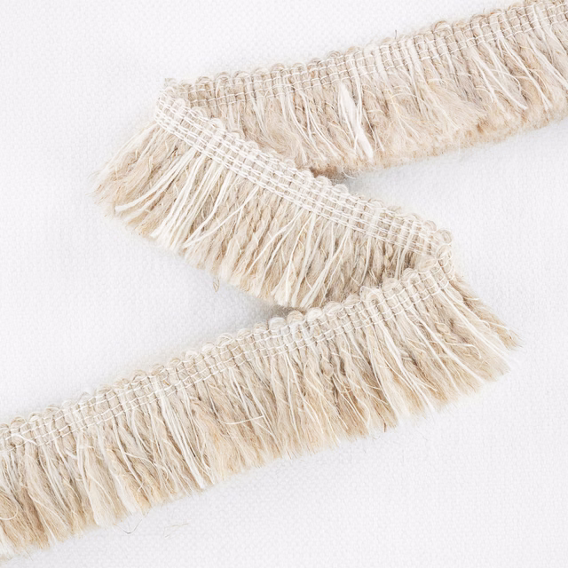 Warm oatmeal and cream woven swatch with broad bands of loose looped fringe