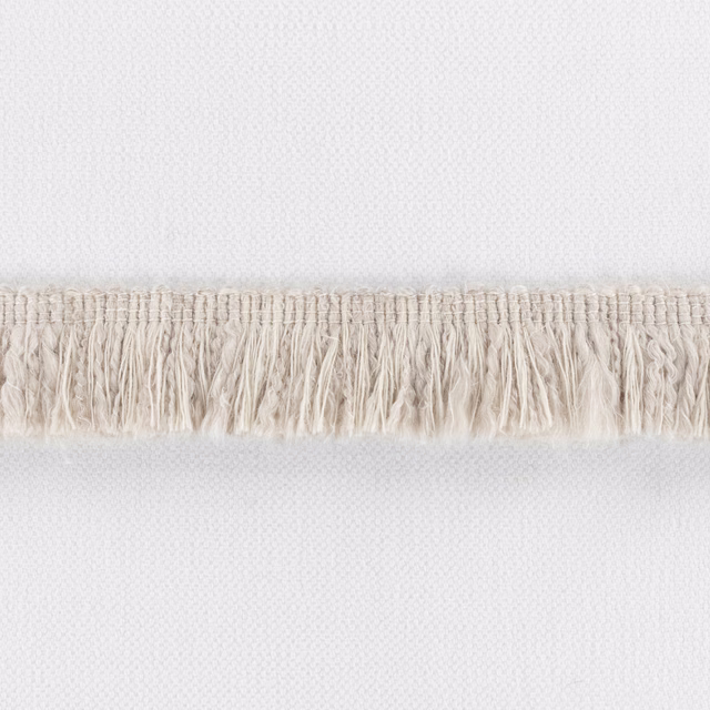 Pale plaster woven textile with fine texture and a horizontal cream fringe