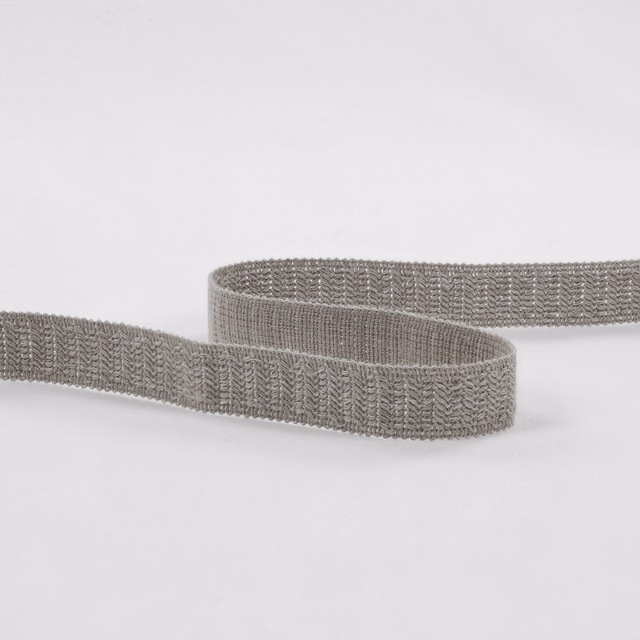 Muted cement-grey woven trim with fine chevron texture, looped across a white background