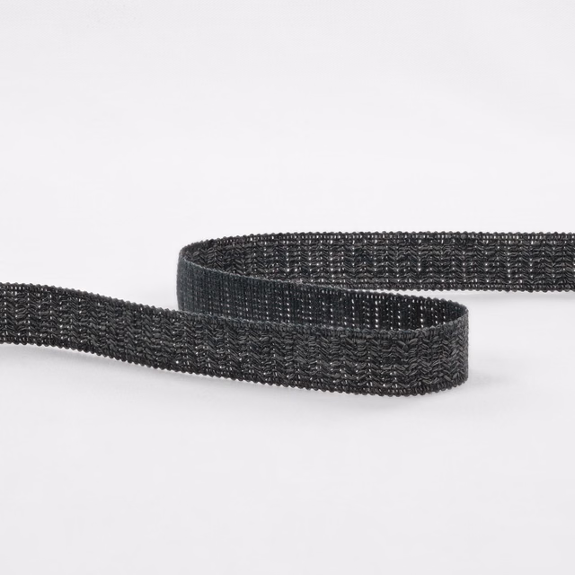 Deep charcoal-indigo woven textile strip with raised repeating texture and subtle blue highlights