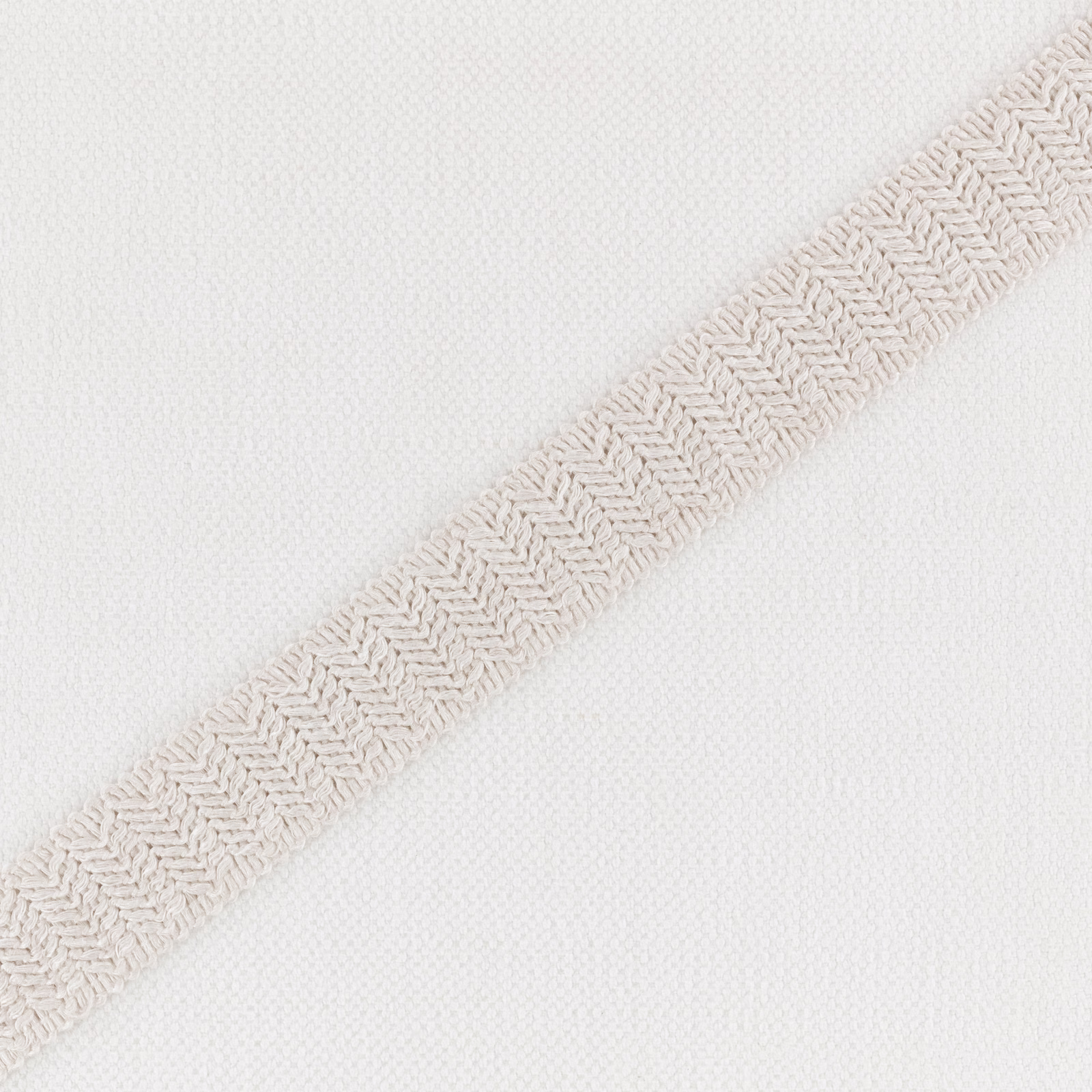 Warm ivory white weave with a raised diagonal herringbone band