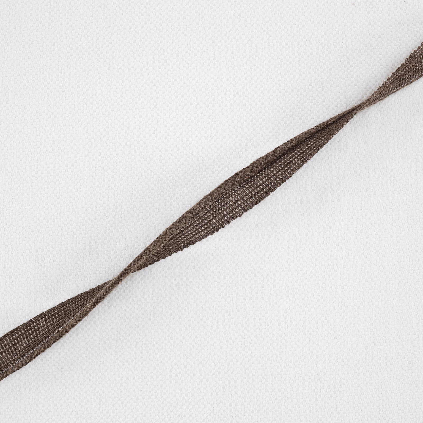 Pale woven fabric with a warm chestnut-brown tapered diagonal stripe
