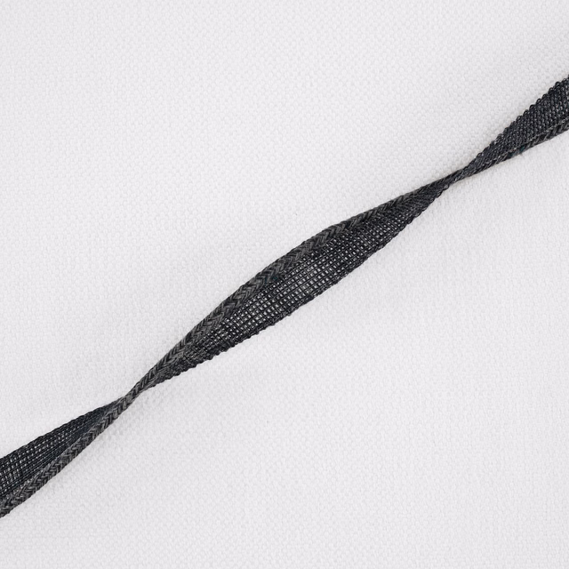 White woven fabric with a dark indigo twisted linear motif