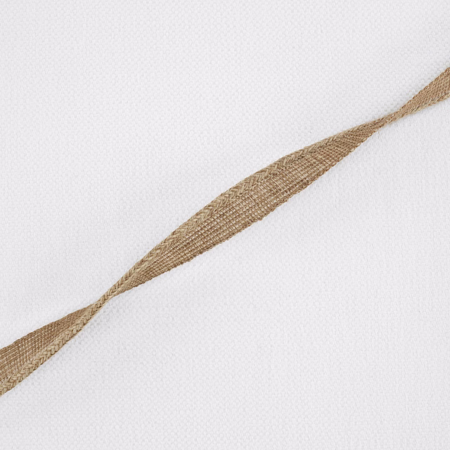 Ivory woven fabric with a warm sand-brown pointed diagonal motif