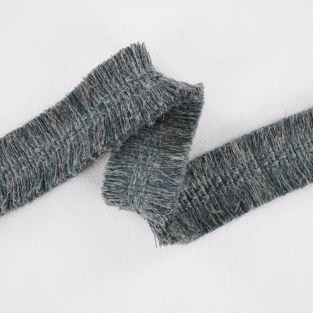 Deep peacock teal textured fabric with raised blue-grey yarns and a shaggy woven surface