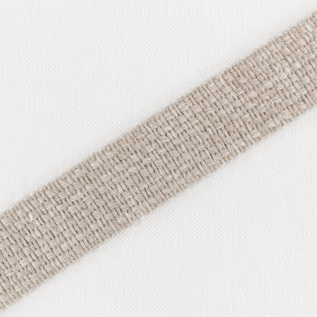 Ivory textile with a warm plaster-beige diagonal band in tactile basket weave