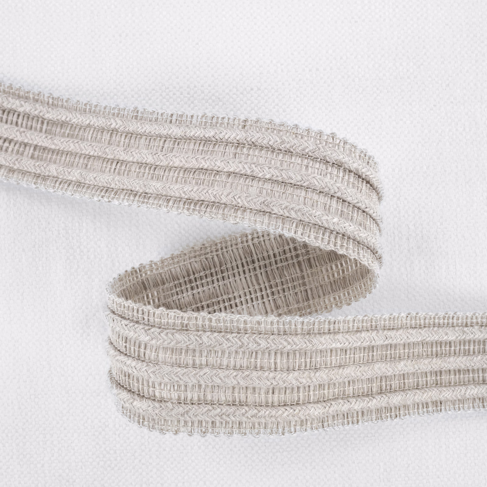 Pale ecru woven fabric with layered horizontal ribs and tactile raised bands