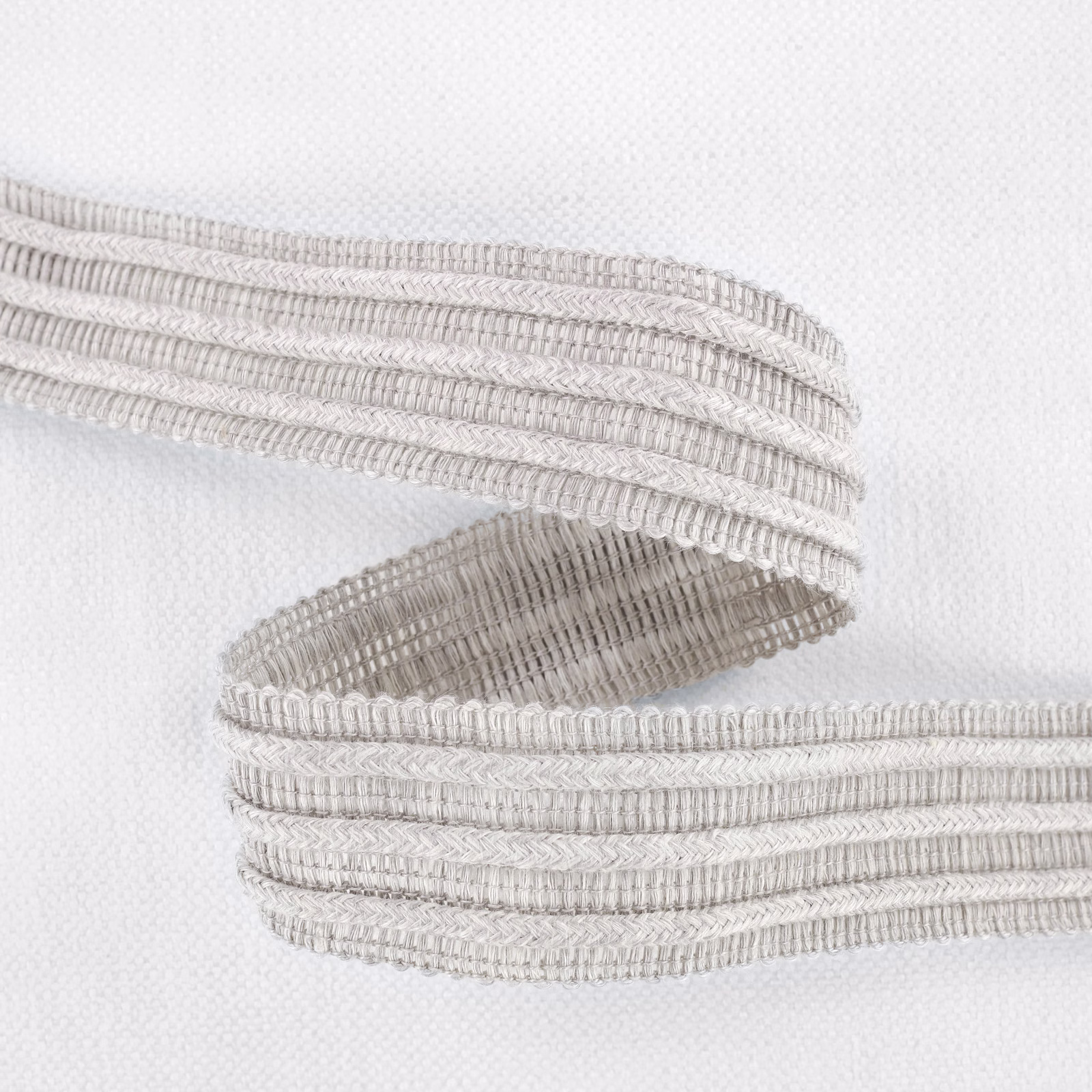Pale silvery-grey textile with raised looped bands over a fine woven ground