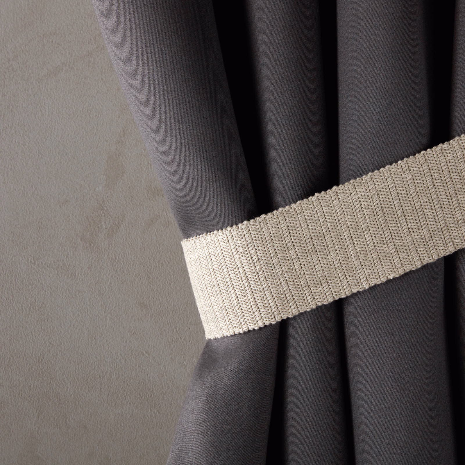 Warm ecru ribbed textile with compact woven diagonal texture