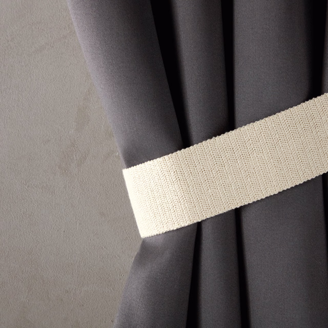 Ivory cream herringbone weave band crossing charcoal drapery