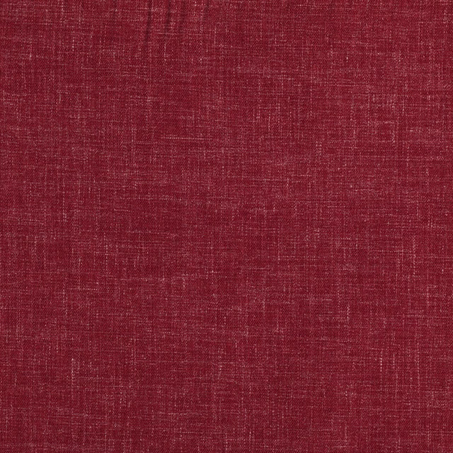 Close-up of warm cinnabar red fabric with a fine irregular slub weave texture