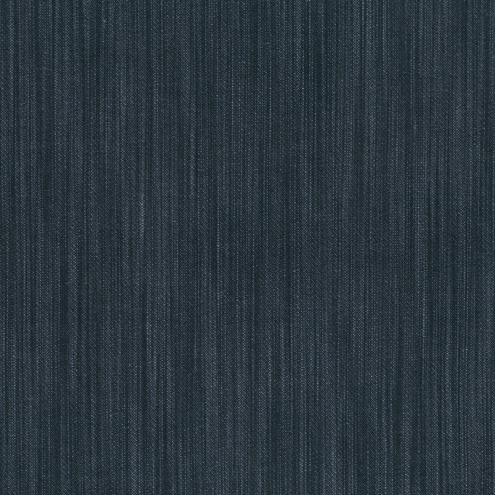 Close-up of dark indigo woven fabric with fine, irregular vertical striations