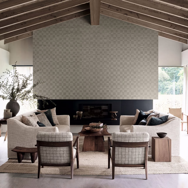 Soft stone-grey basketweave check wallpaper shown across a bright living-room feature wall