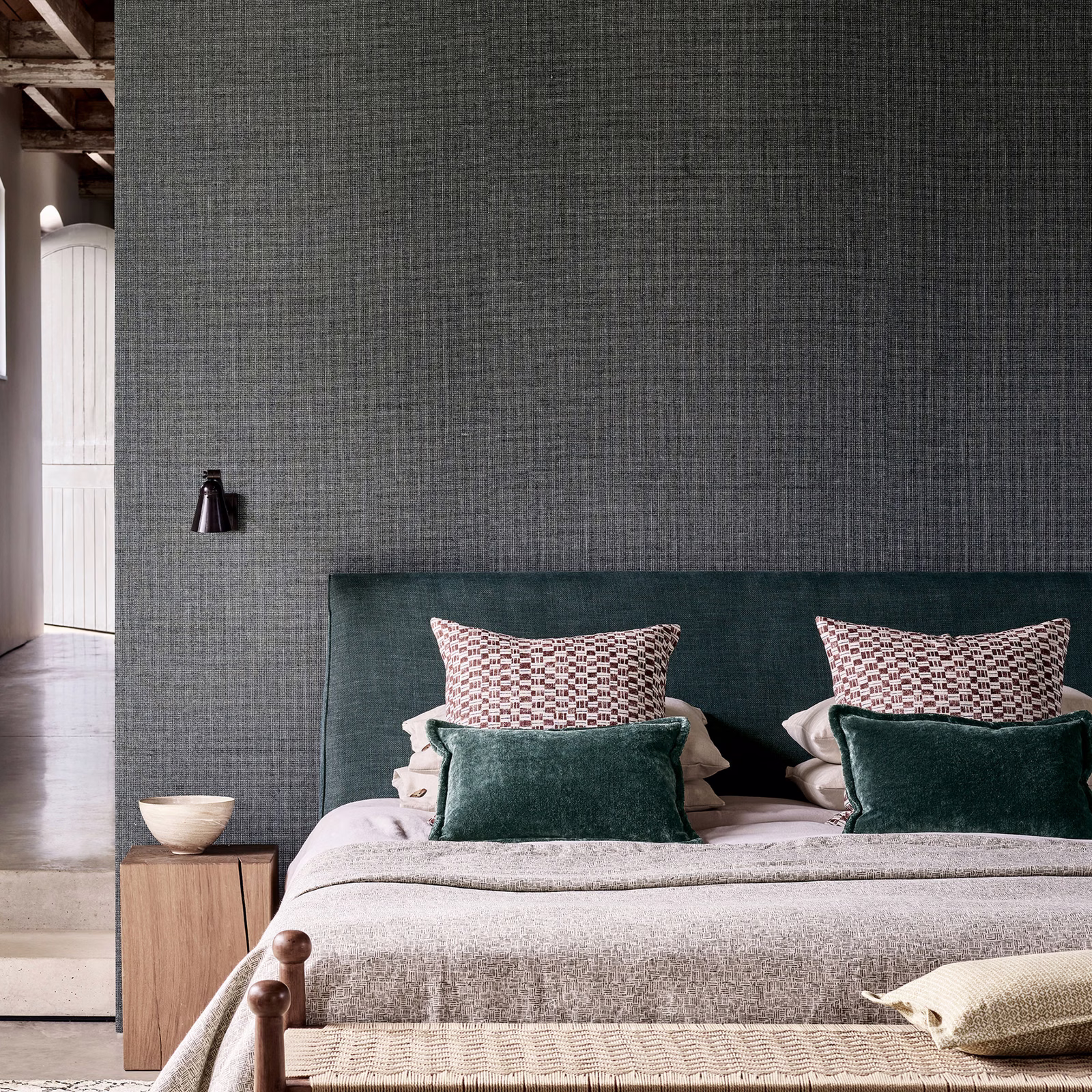 Charcoal grey textured wallpaper with a fine crosshatched woven surface
