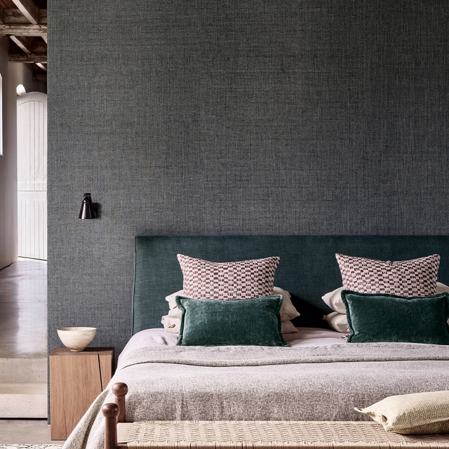 Charcoal grey textured wallpaper with a fine crosshatched woven surface