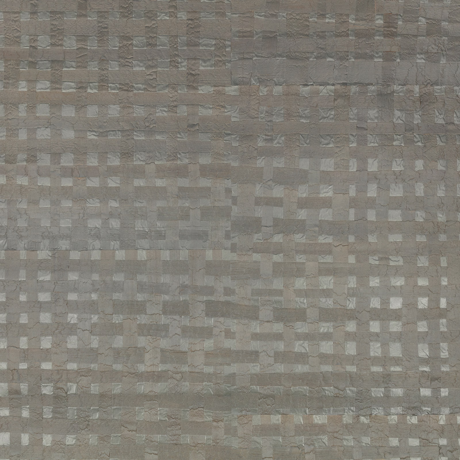 Taupe-grey metallic wallpaper with small irregular rectangular blocks and a softly textured surface.