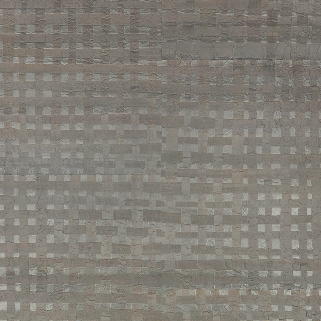 Taupe-grey metallic wallpaper with small irregular rectangular blocks and a softly textured surface.