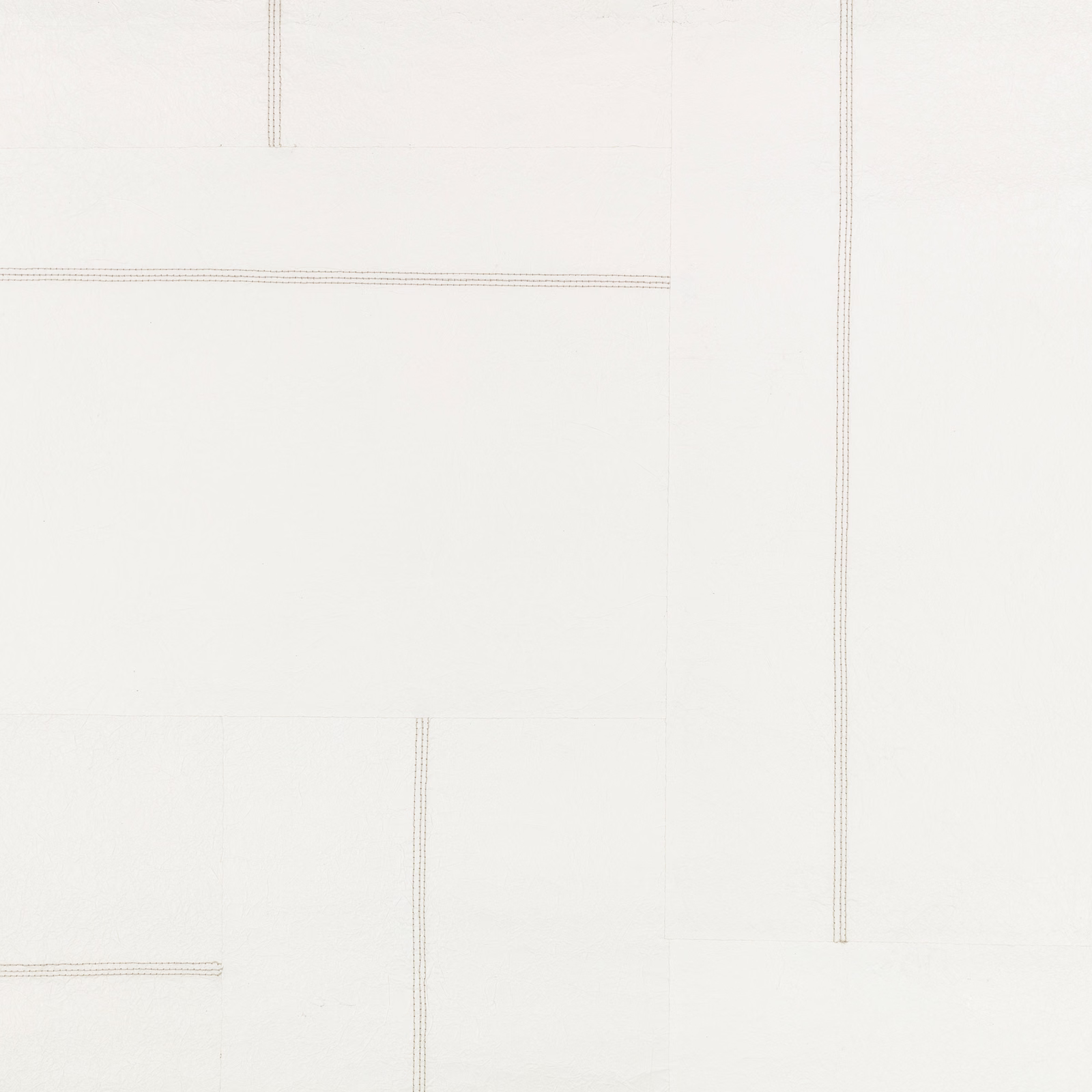 Chalk-white wallcovering with faint grey linear rectangles and fine vertical rules
