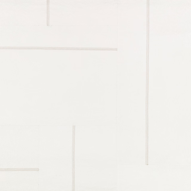Chalk-white wallcovering with faint grey linear rectangles and fine vertical rules