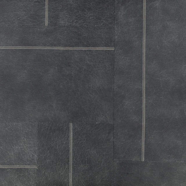 Dark indigo wallcovering with pale linear rectangles and a distressed fibrous texture